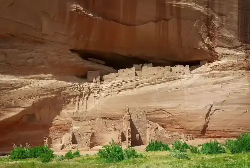 White House Ruin, an ancestral Puebloan cliff dwelling beneath a streaked sandstone wall